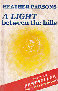 Couverture A light between the hills